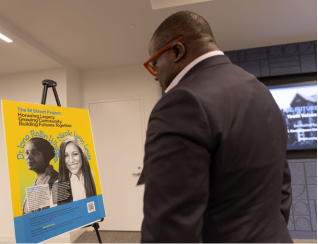 Visitor viewing an M Street poster on an easel